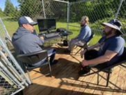  Brian Lomerson, left, explains the air monitoring system to Drew Yesmunt and Joe Scanlan.