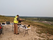 EGLE staffer Mike Shelton preparing a drone for its next flight to monitor methane emissions.