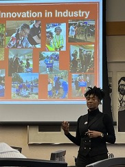 MI Healthy Climate Corps member Jessica Austin gives a presentation.