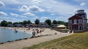 Beachgoers enjoy strolling and swimming at the shore of Lake Erie. Courtesy of City of Luna Pier.