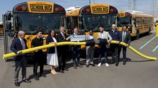 EGLE Director Phil Roos joins others at an event celebrating of the deployment of 18 electric school buses recently in Dearborn.