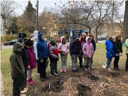 Past Environmental Service Award recipients at Grand Rapids Montessori engaged in stewardship work outside