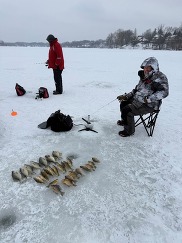 EGLE staff ice fishing at Reeds Lake in East Grand Rapids in February 2026.