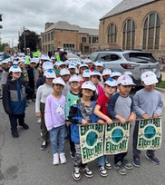 students line up for an Earth Day parade