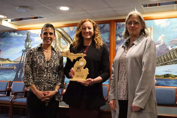 Oakland County Health Division with plaque