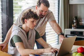 kid and dad on computer