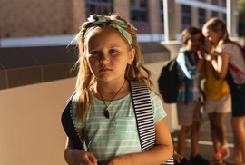 Sad girl with backpack