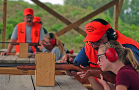 Young woman taking hunter education class