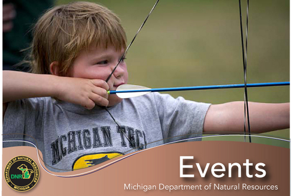 Young boy shooting a bow