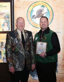 Ed Shaw accepts NWTF award from Jon Gray