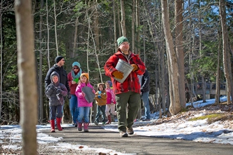 Park interpreter leading guests on a trail