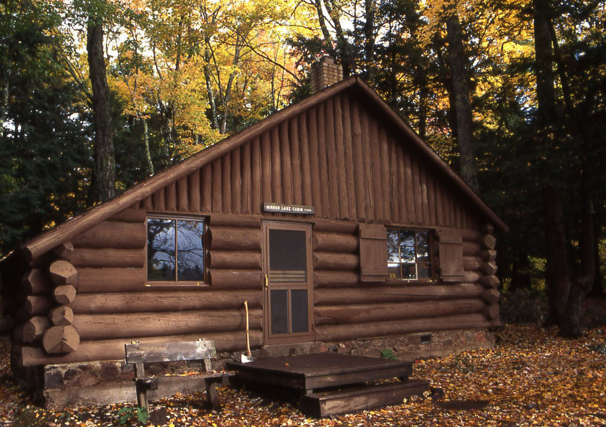 The front side of a cabin at Mirror Lake in the Porcupine Mountains is shown.