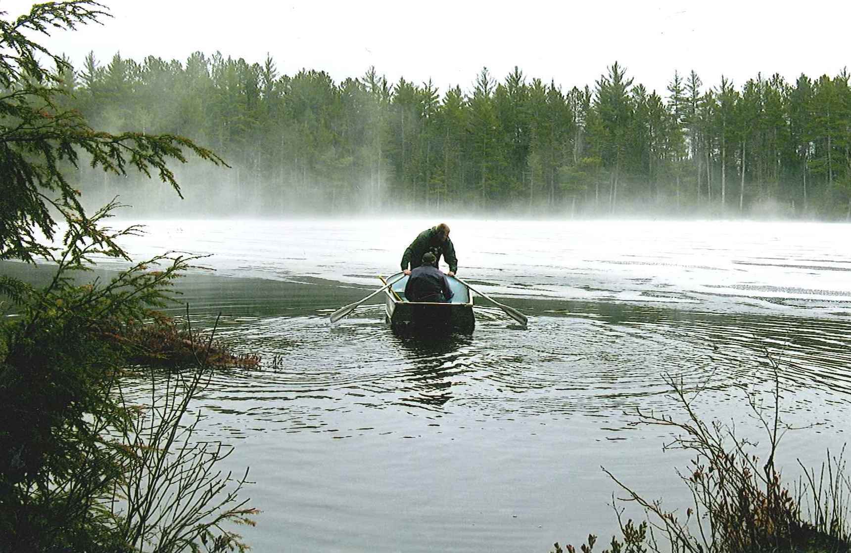 Using a boat to break out ice on an Upper Peninsula lake for a trout season opener.