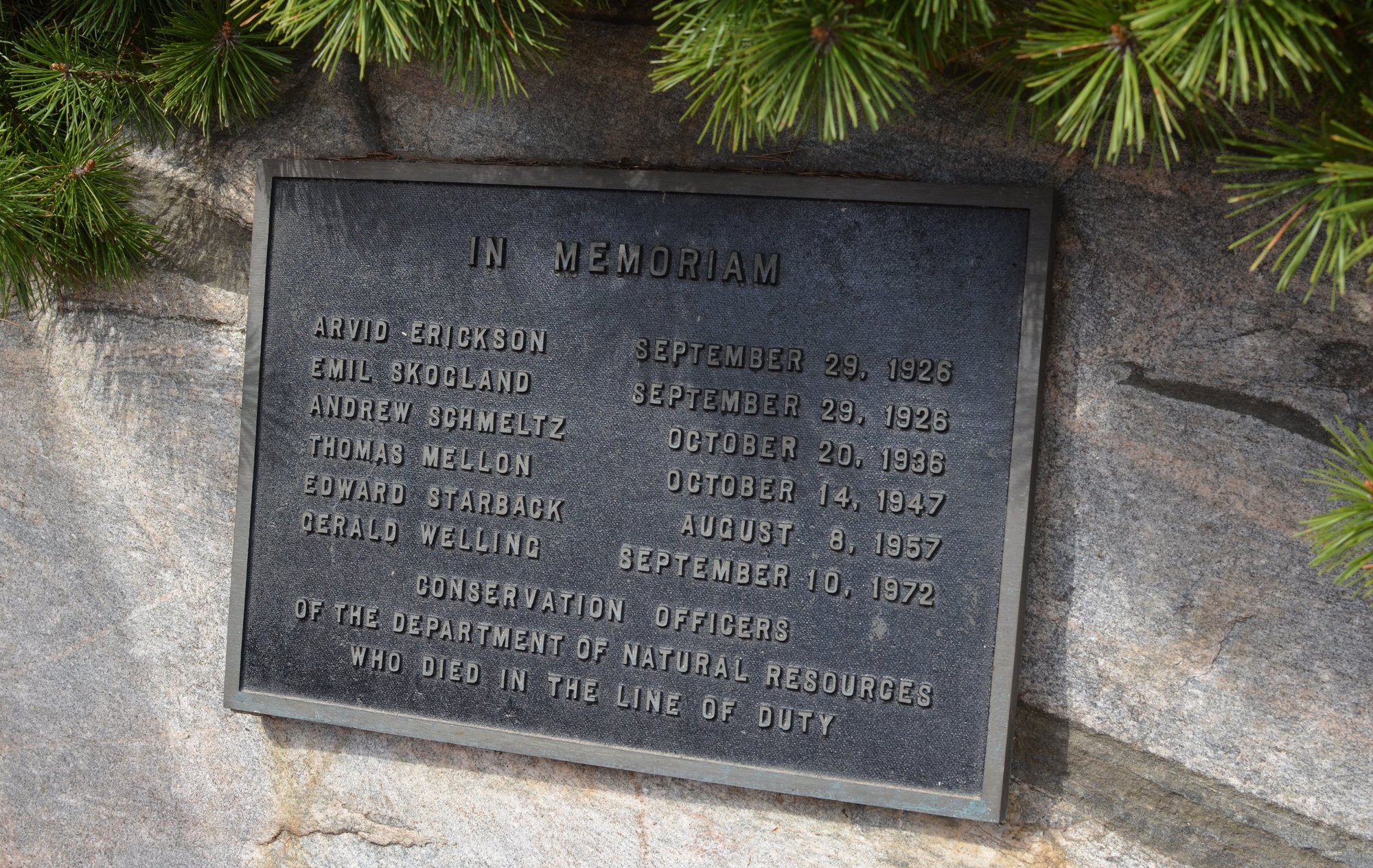 A memorial plaque outside the Michigan DNR Customer Service Center in Marquette remembers six fallen conservation officers.