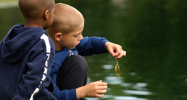 Fishing kids with tiny fish.