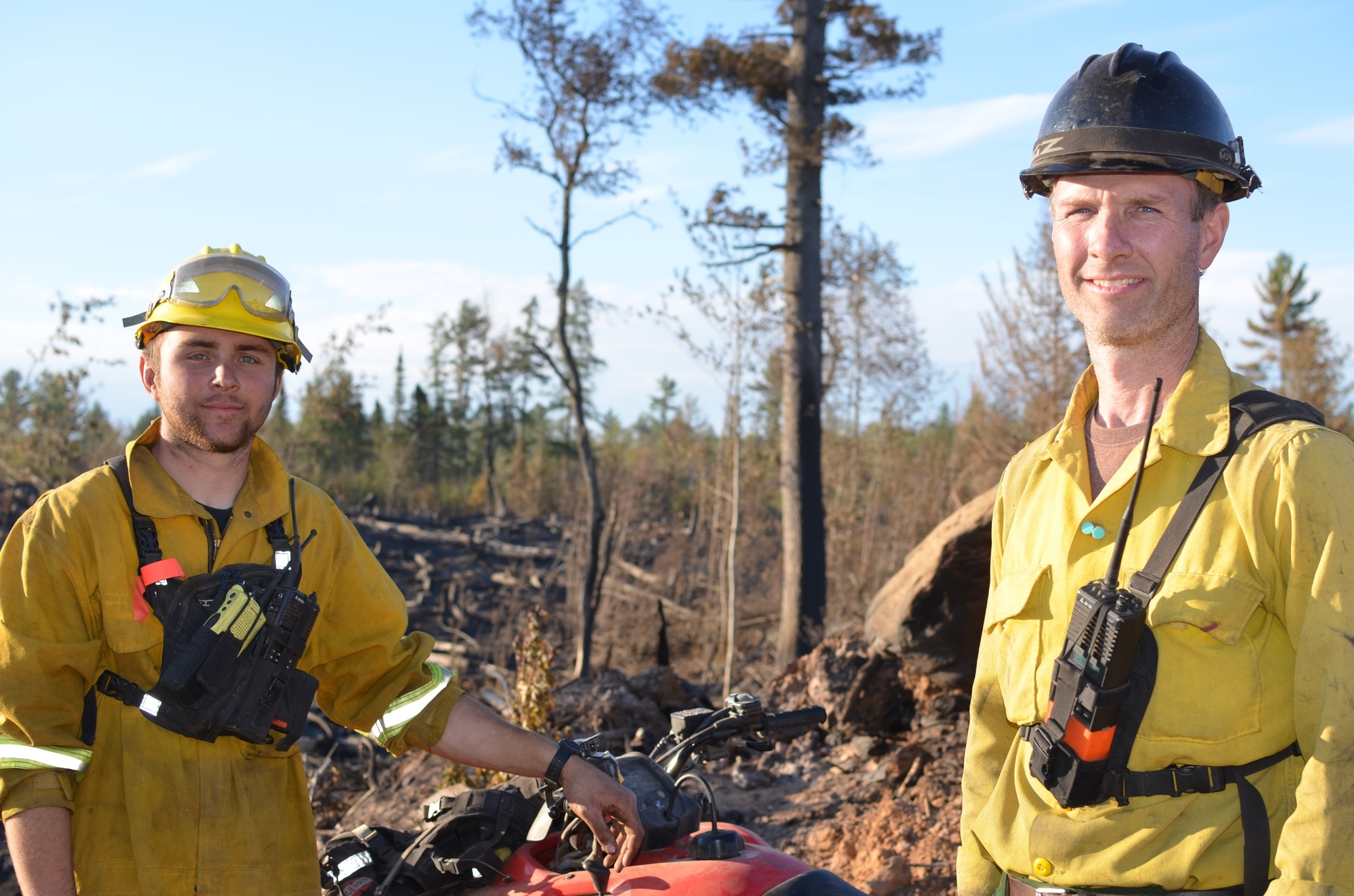 Michigan Department of Natural Resources firefighters Jacob “Jake” Burton, left, and Ed Rice photographed during the County Road 601 Fire in July 2015