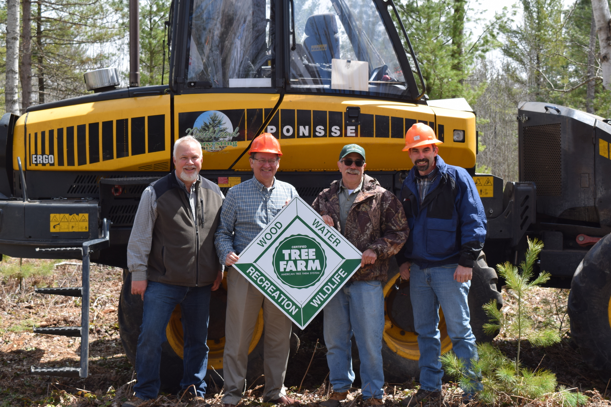 Senator Peters stands with the loggers