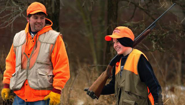 boy hunting with dad