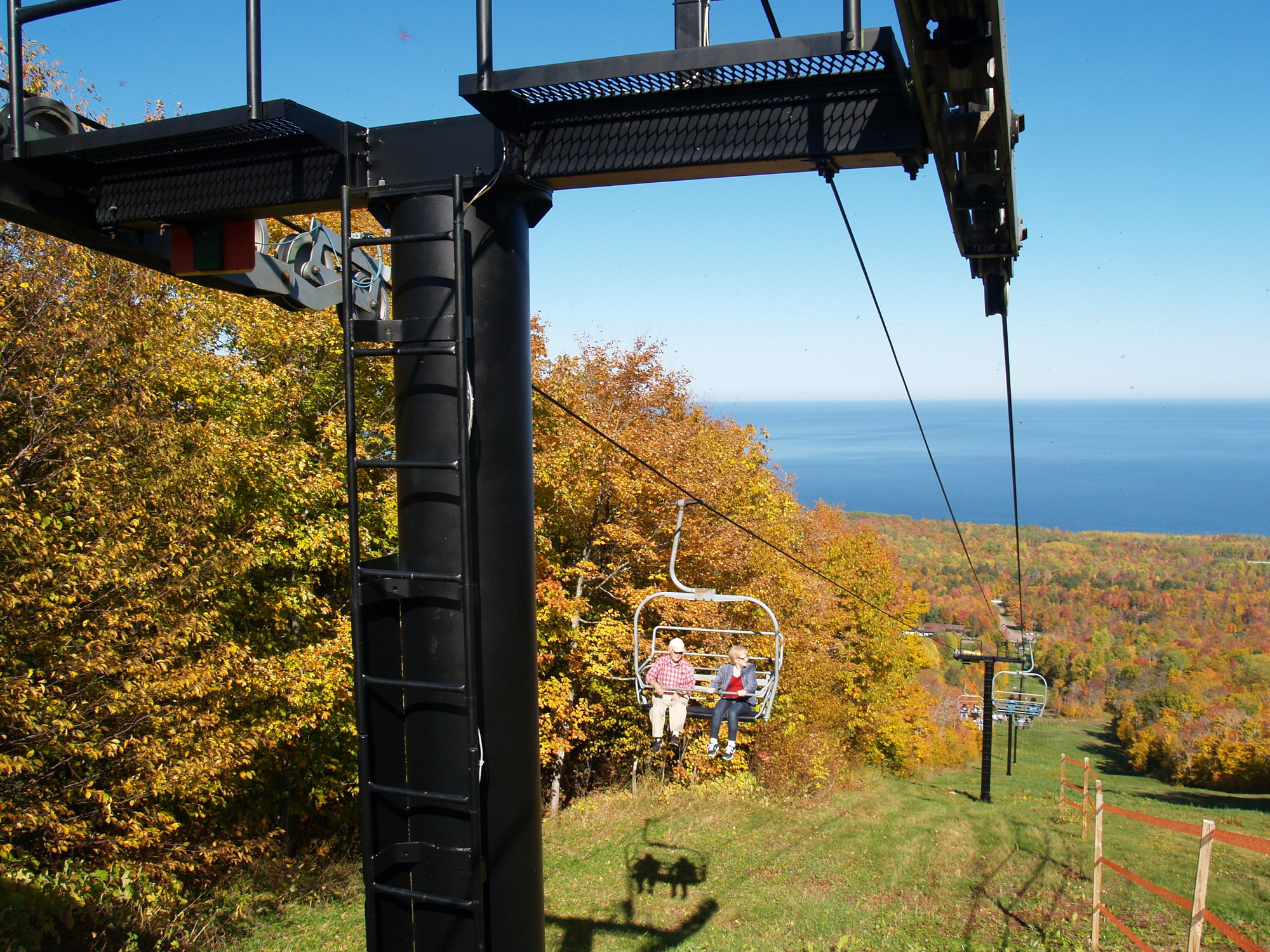 Visitors to Porcupine Mountains Wilderness State Park enjoy a chairlift ride to view the fall colors.