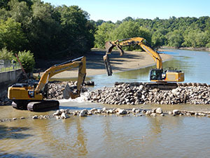 Heavy machinery removing Lyons Dam