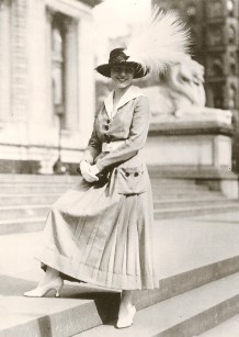 black-and-white photo of a woman wearing a feathered hat (USFWS)