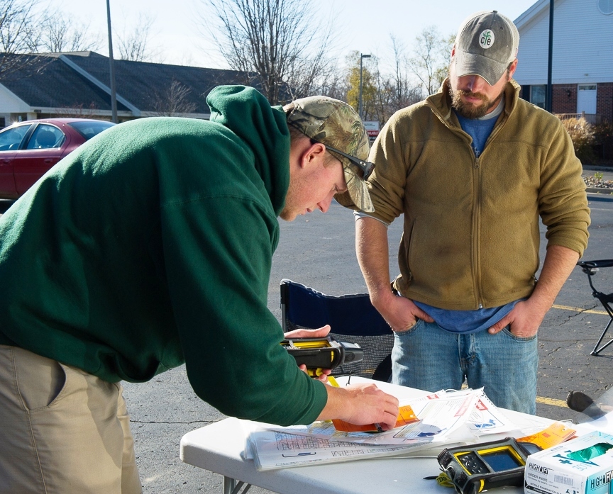 A hunter checks a deer in at a Michigan Department of Natural Resources check station in the Lower Peninsula.