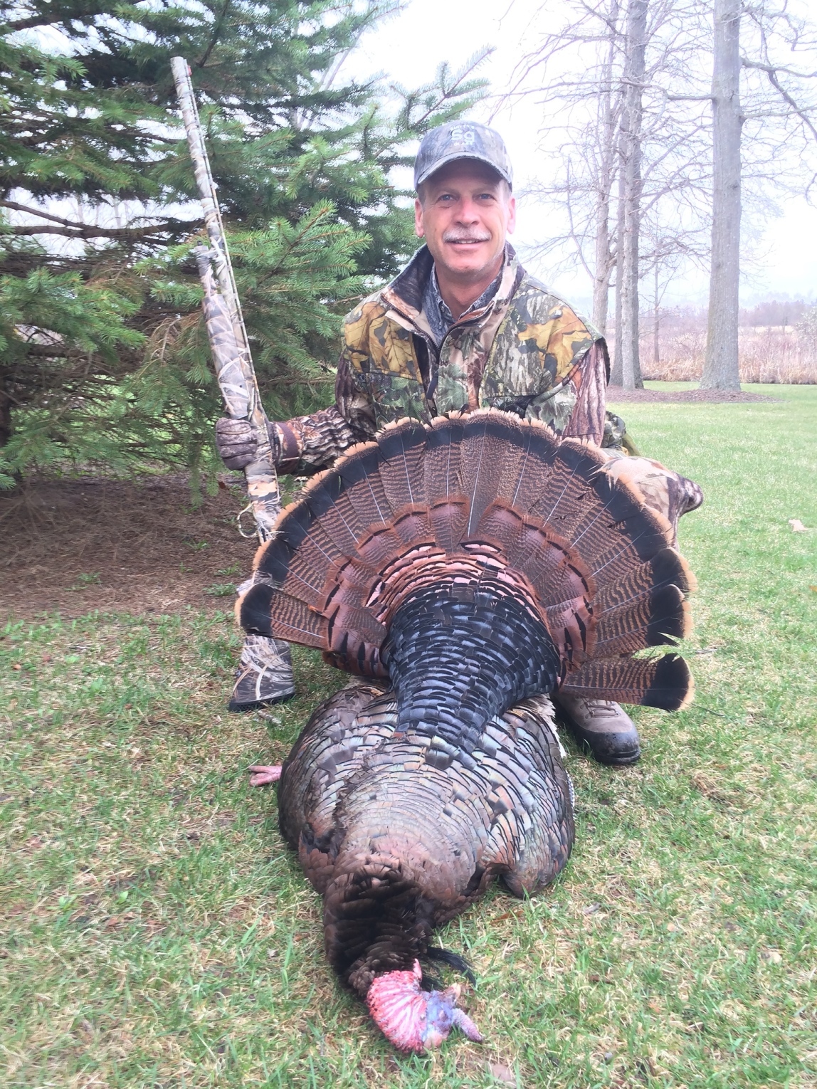 Bruce Shaneour of Osseo shown with the prize he bagged on his 2014 Pure Michigan spring turkey hunt.