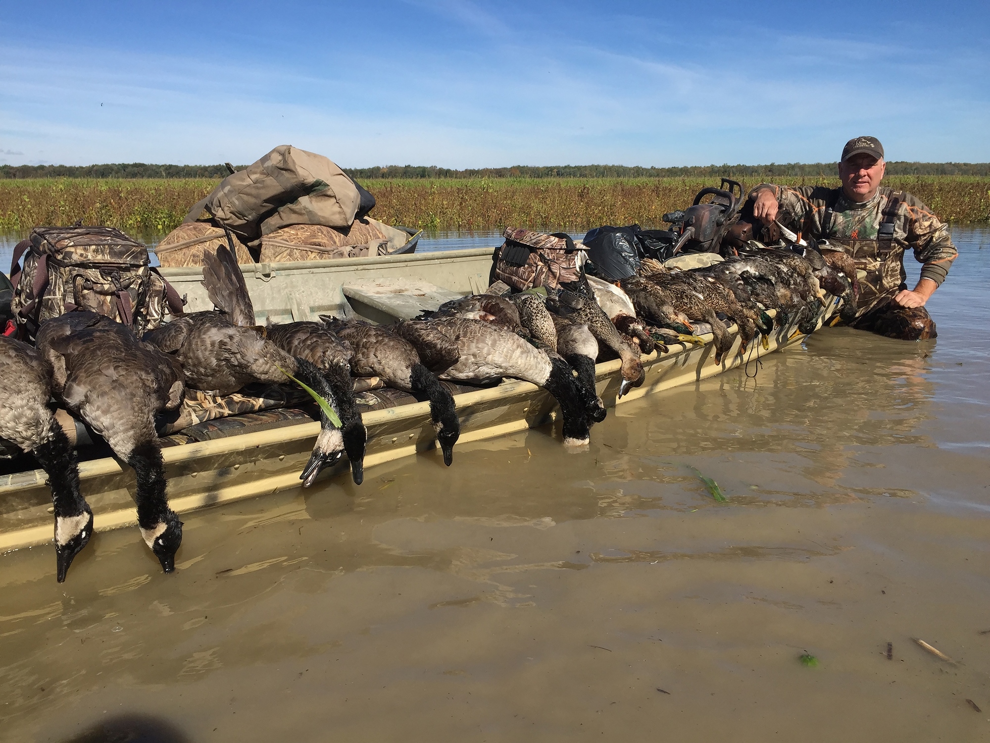 Pure Michigan Hunt 2015 winner Jason Eurich of Saginaw with geese and ducks he bagged.
