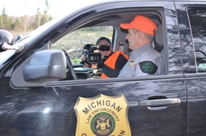 video films conservation officer in patrol truck