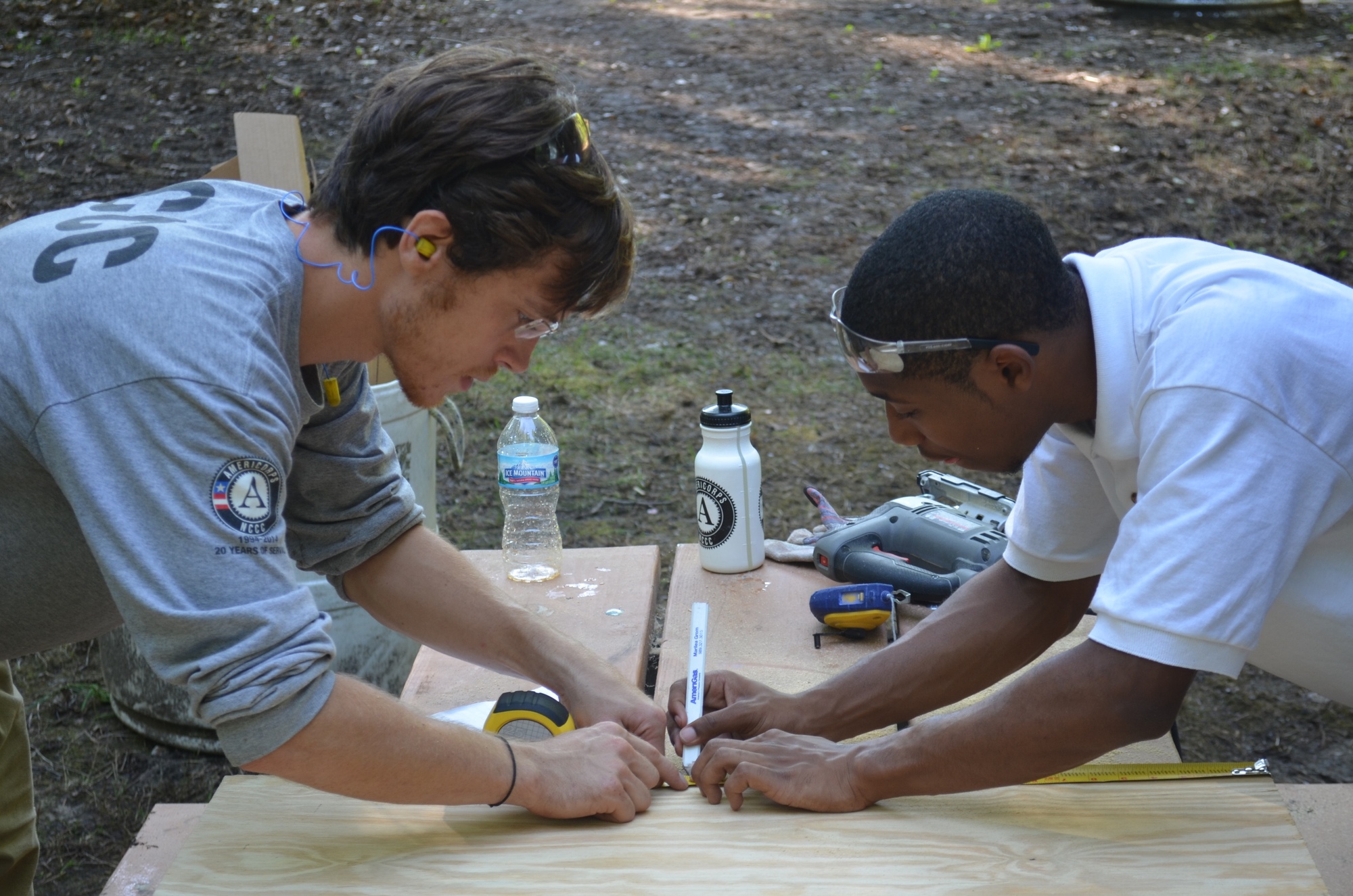 AmeriCorps NCCC members worked with Summer Youth Employment Program participants at Waterloo State Recreation Area to refurbish cabins near Mill Lake.
