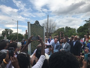 view of crowd surrounding the Detroit July 1967 historical marker