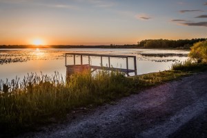 sunset over Kawkawlin Creek Flooding in Midland County