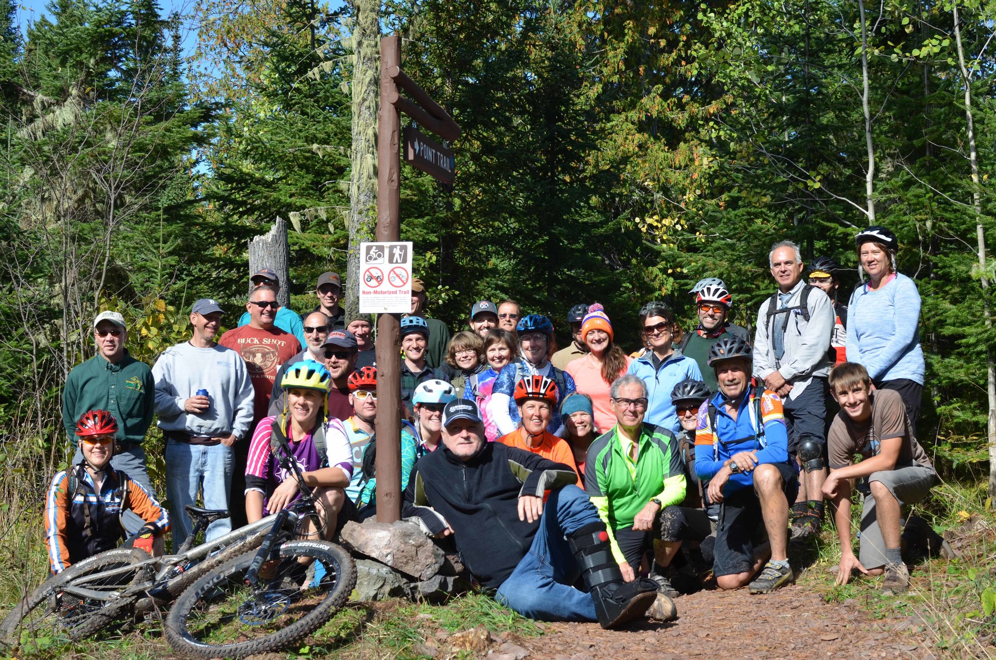 A group of mountain bikers and others gathered Thursday at High Rock Bay to celebrate the opening of a new section of the Keweenaw Point Trail.