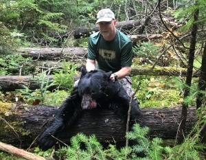 Pure Michigan Hunt winner Richard Farris with harvested bear