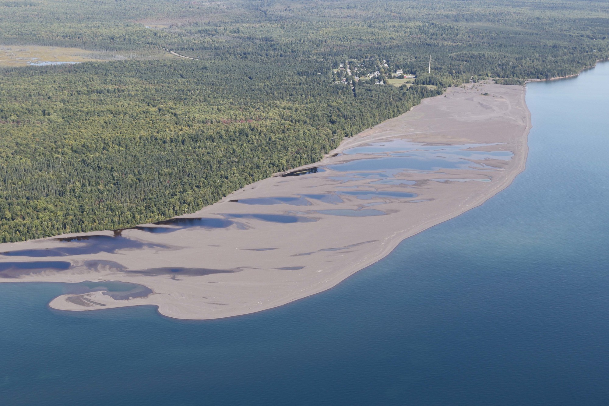 An aerial photo shows the movement of stamp sands from the community of Gay south toward the Grand Traverse Harbor. (Neil Harri photo)