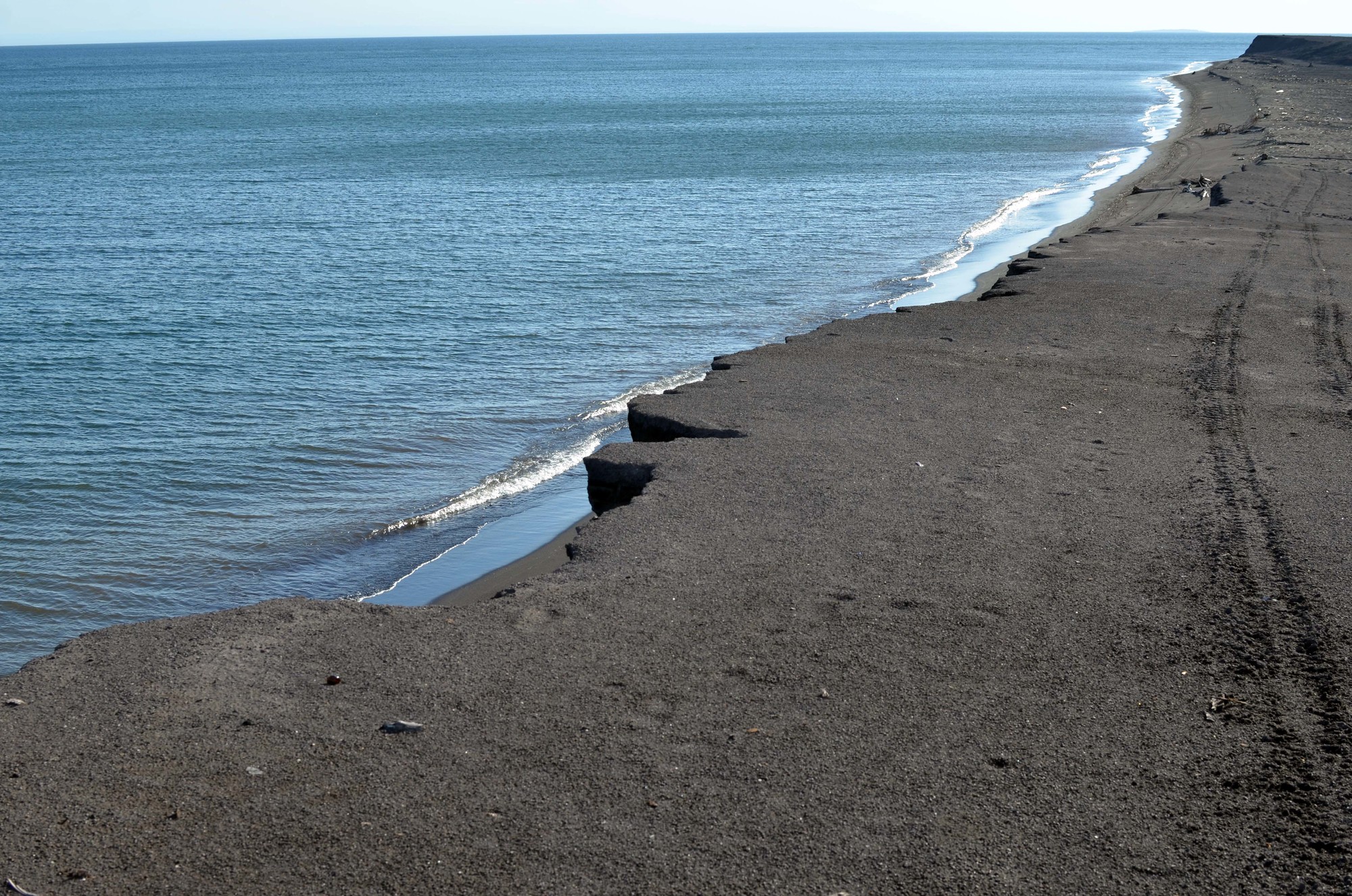 The coastline along Lake Superior at Gay is covered with a thick layer of stamp sands, which extend south to the Grand Traverse Harbor.