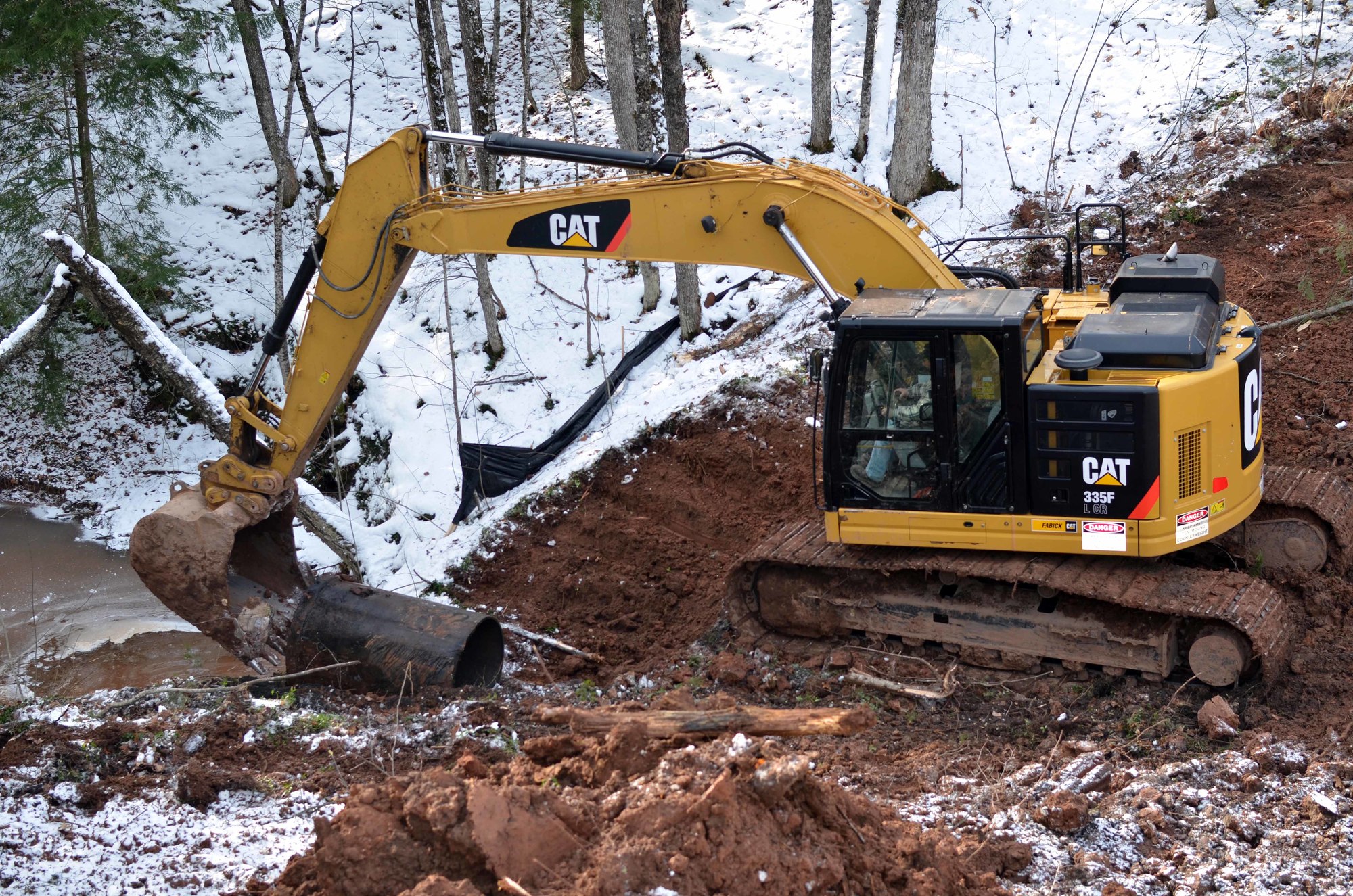 The first section of the old culvert is removed.