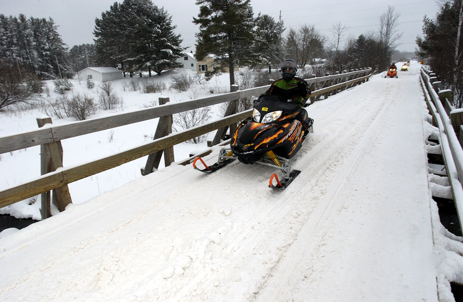 Snowmobilers contribute to their sport through trail and license fees.