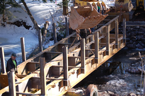 Workers are shown replacing the Mud Creek Bridge in Gogebic County.