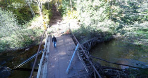 The damaged Mud Creek Bridge is shown weels after the August 2016 storm.