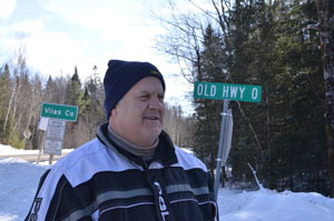 Landowner and snowmobile trail proponent Bill Lafond stands at the Michigan-Wisconsin border, just off Trail No. 11 South.