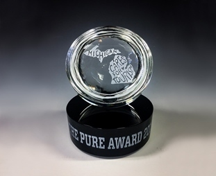 the 2018 Pure Award, given by Michigan Travel Commission this year to Michigan Cares for Tourism.