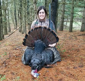 female hunter with turkey