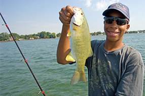 Kid fishing on Detroit River