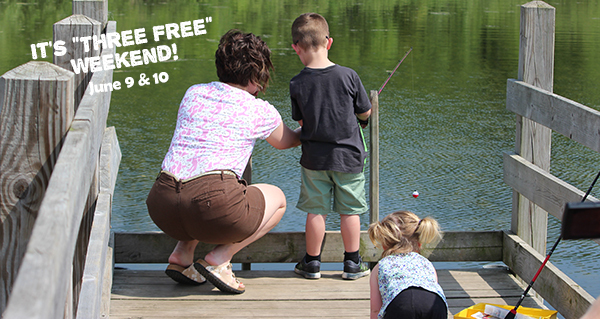 Mom with two kids fishing off wooden pier