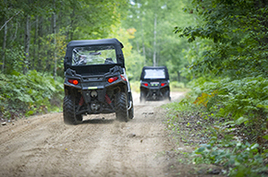 two off-road vehicles riding a trail