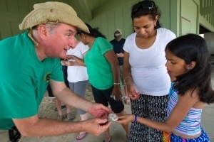 DNR staffer showing girl mammal track cast