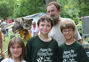 man holding own with kids
