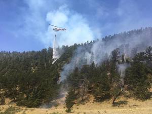 Helicopter quenching fire in Colorado.