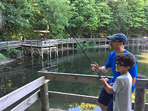 man and boy fishing from dock at Maybury State Park